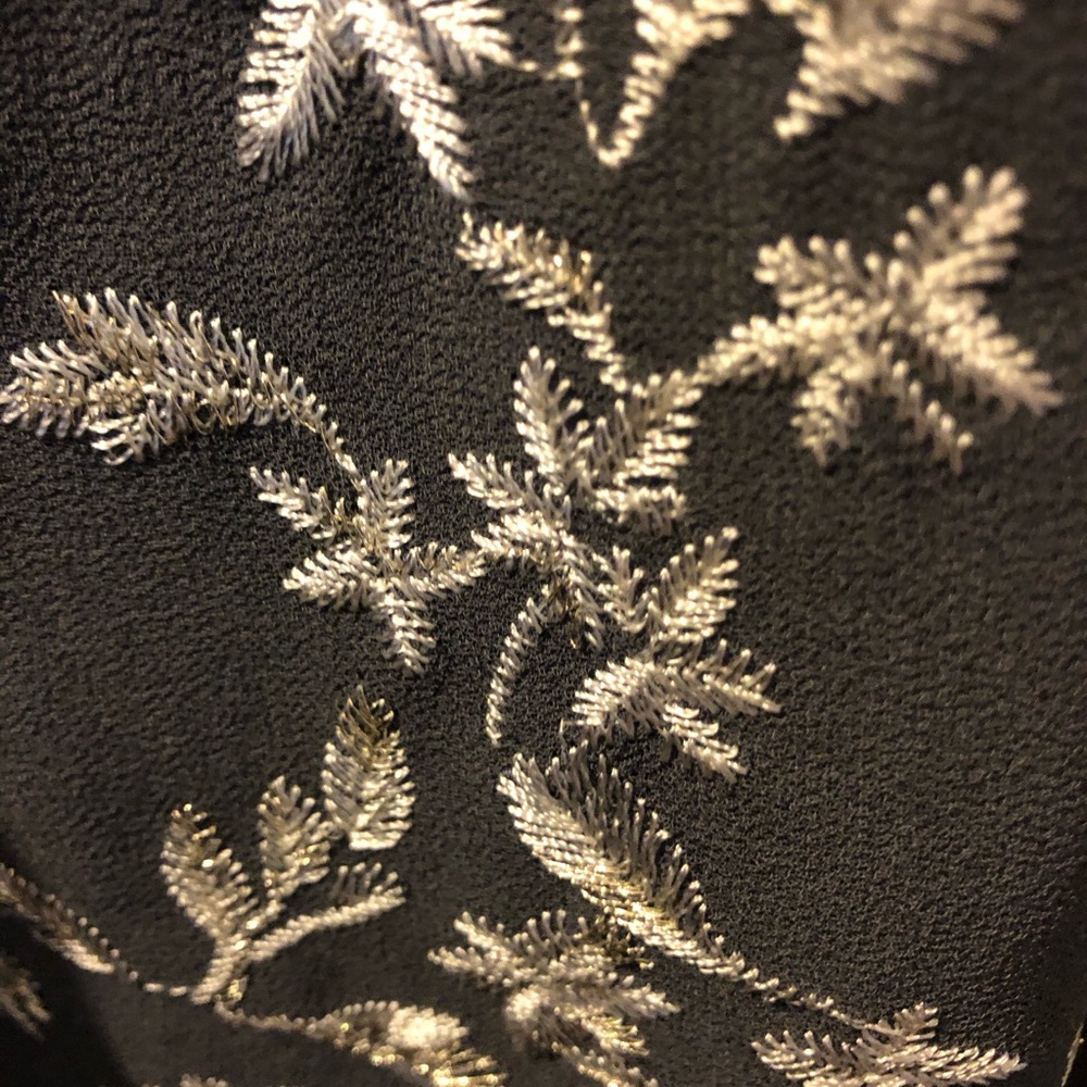 Beautiful gray dress with embroidered flowers.